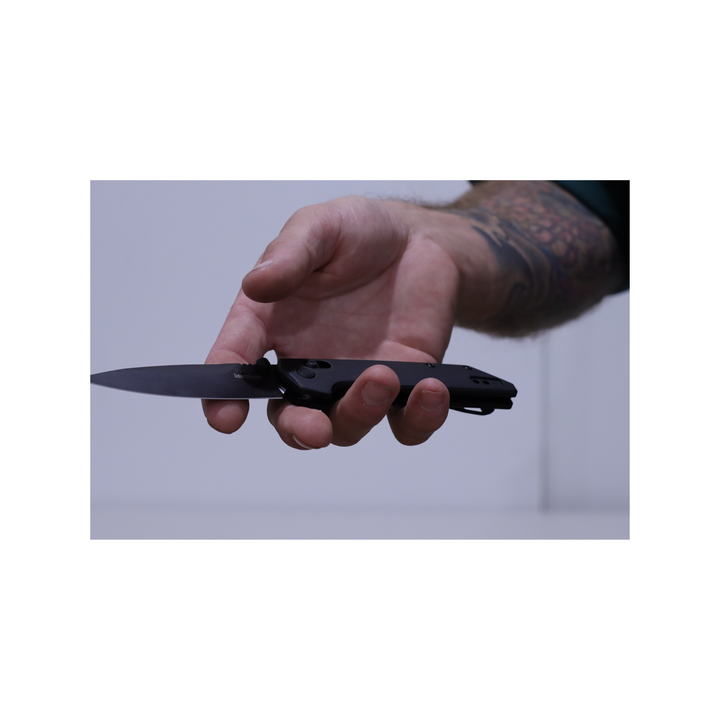 Kershaw 2038BLK Iridium, D2 Spear Point Blade, All Black Model in hand