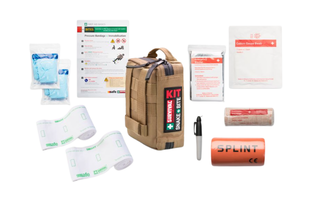 Open view of Snake Bite Kit showing SMART Bandage, compression bandages, and medical contents