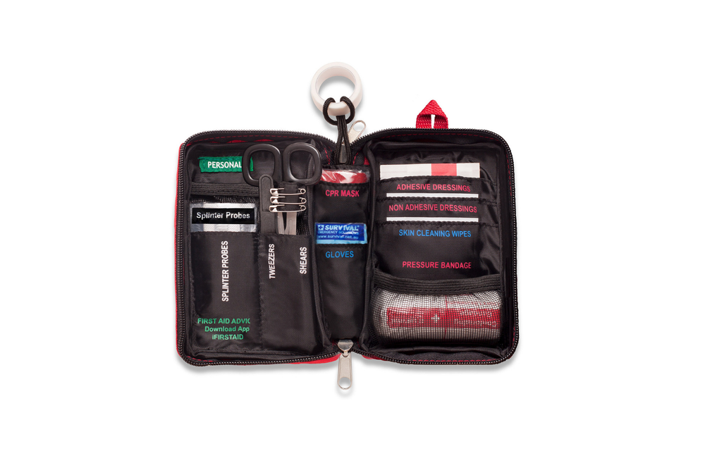 Compact red first aid survival kit with labeled compartments for quick access